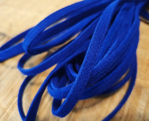 flat suede leather strip stitched on sides