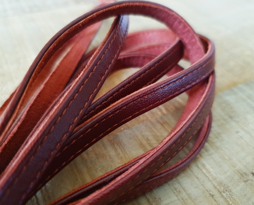 flat cord with stitched leather lining