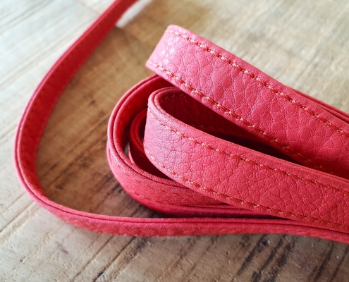 double folded leather strip with stitching